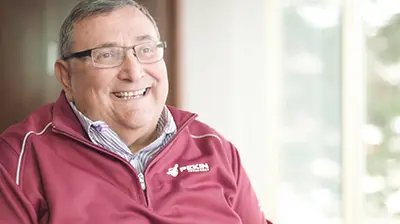 Pekin Customer Success Man in casual attire facing forward and smiling.