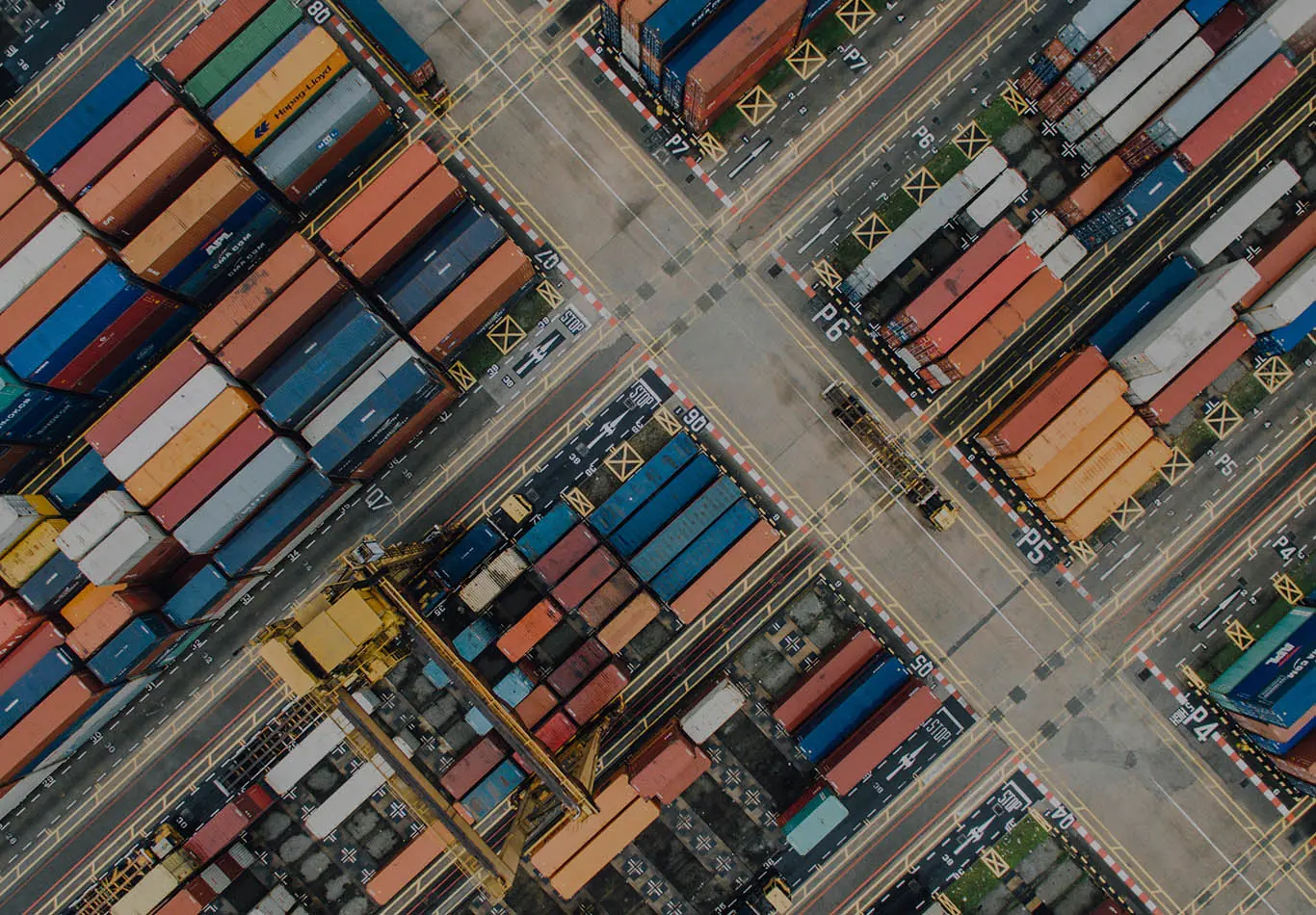 Bookroll Key Benefit 3 There are a cluster a shipping crates intersected by streets